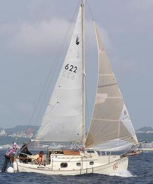 Summer 2006. The Tsurutas enjoy their first sailing aboard their new Flicka in Okinawa, Japan. (Her sail # reflects one of her previous owner's birthday.)