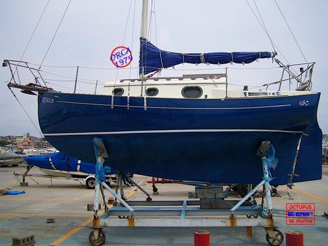 Spring 2008. After an extensive blister-rapair job, she received a new blue gelcoat to her entire hull. 