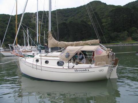 She is famous for her fully enclosable cockpit. The opening is filled by a side cover, which is being taken down by the owner from insdie in this photo from 2005 San Francisco Bay Rendez Vous.