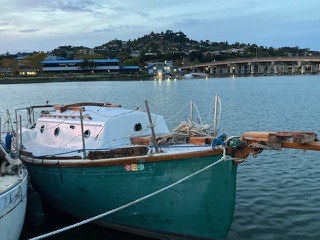 A 1977 gaff-rigged Flicka 20 for sale on San Francisco Bay, lying at her berth with her spars on deck