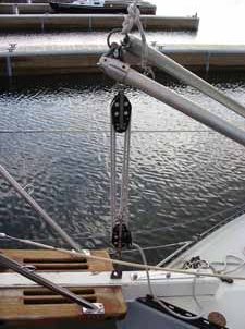 The main sheet was used to lower the mast to the deck. This works perfectly allowing you easily control the weight of