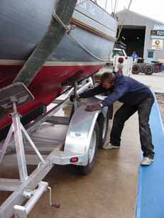 After lowering BEN MAIN, Jr. onto the trailer, each of the pads were adjusted