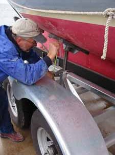 The pad height was measured and adjusted as required to center the hull on the trailer
