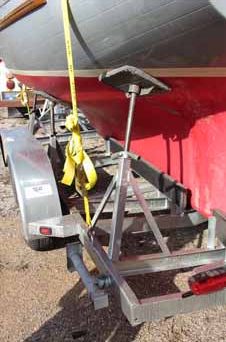 The aft-port flat pad was ex- tended to meet the hull. Also, note the gap in the guides that allows placement of the lift strap.