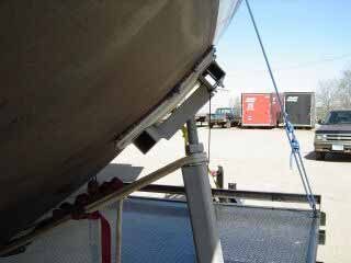 The trailer pads allow the plywood to flex and adapt to the shape of the Flicka’s hull