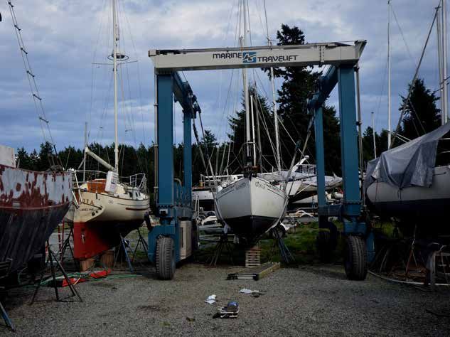 Getting s/y BLUE SKIES ready for launching. Note the covers on the straps