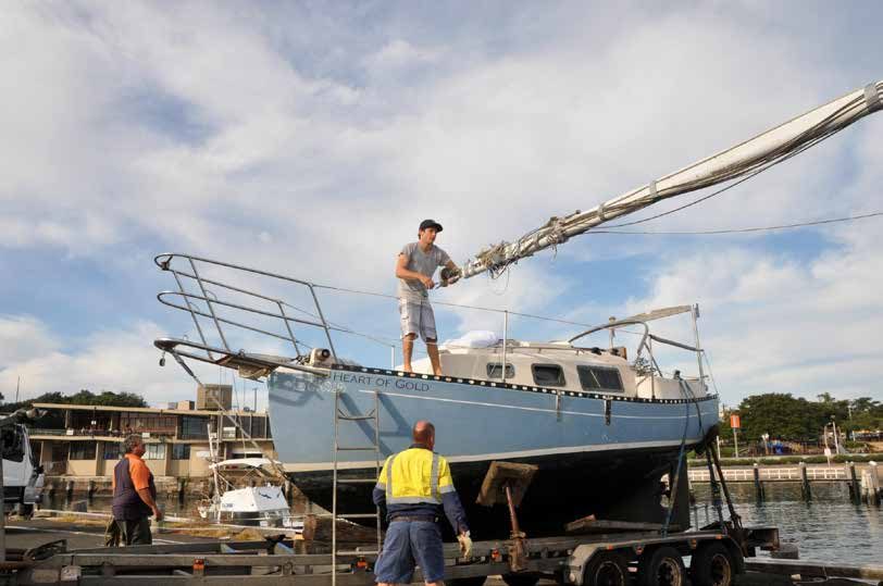 Positioning the mast aboard for the road passage to storage