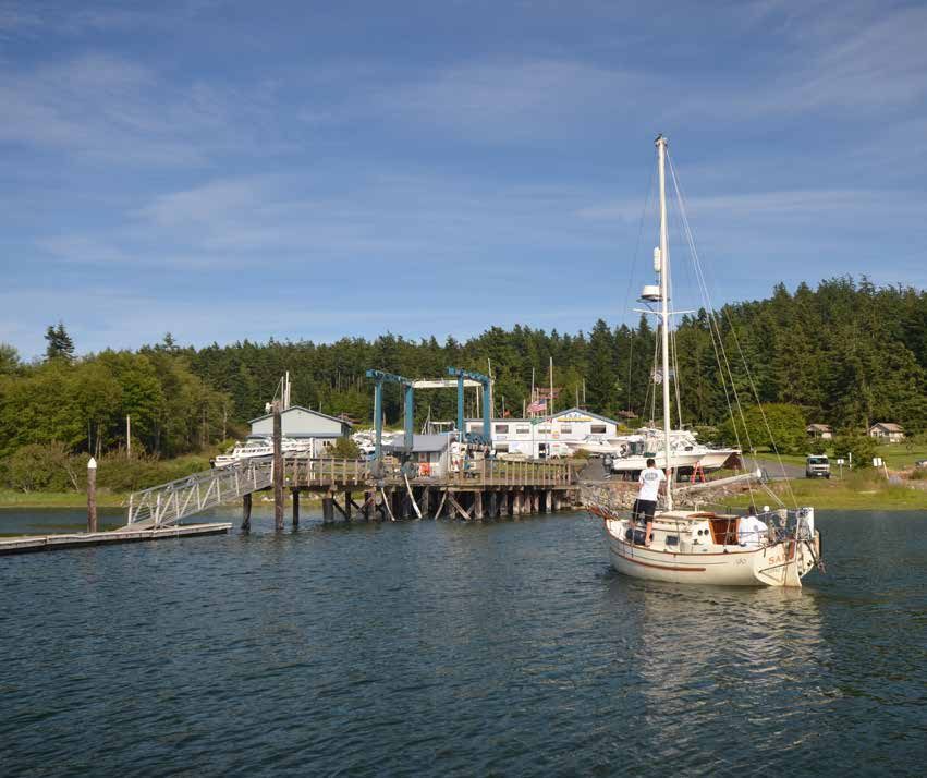 The marina crew is moving s/y SARNIA to the Travel-lift dock. A four foot tide is required at this dock for hauling a Flicka